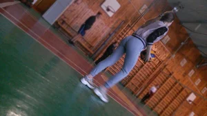 Girl Playing Volleyball in Gymnasium Candid Photos