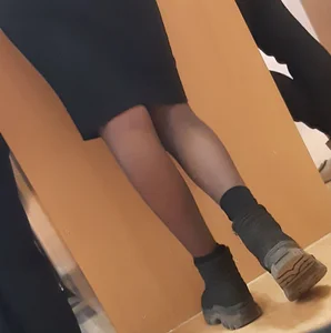 Legs of candid college teens wearing pantyhose in class