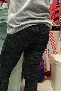 Ass standing around in tight grey patterned leggings