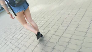 Girl walking in denim shorts showing some of her ass cheeks