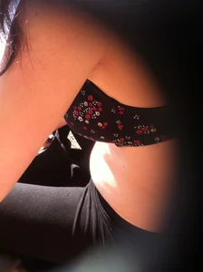 Breast under bra peeks