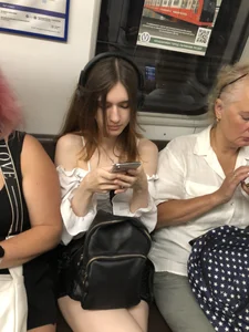 Cute candid girl with pale sexy legs sitting in subway train creepshots