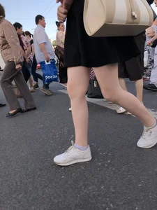 Candid girl wearing a short skirt crossing the street, awesome pale legs