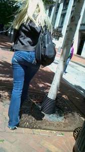 Blonde in tight jeans with her red thong sticking out