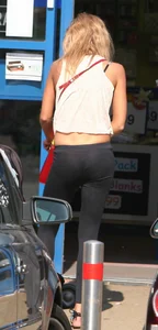 Sexy and slim blonde in see thru leggings with thong