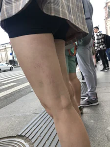 Closeups of a gorgeous girl wearing spandex mini shorts crossing the street