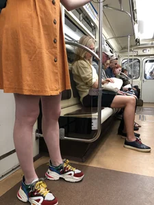 Cute Teen Girl in a Dress With Slim Legs Standing in the Subway Train, Then Crossing the Street Photo Gallery