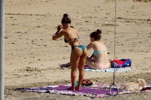 Sexy mix of girls in bikinis at the beach