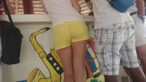 Milf in yellow shorts with vpl and a wedgie