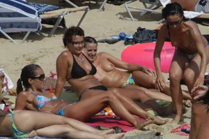 Topless girls on a beach in Barcelona