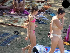 Beautiful and sexy teen in pink thong bikini