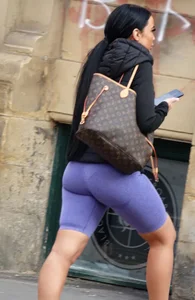 Wide hipped, juicy fronted tanned brunette pawg struts in lycra shorts