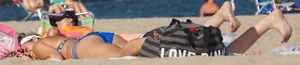 Beach babe in a blue bikini with thick friend in shorts