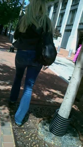 Blonde in tight jeans with her red thong sticking out