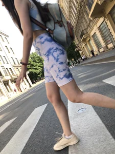 Cute candid girl in tight shorts on a crosswalk