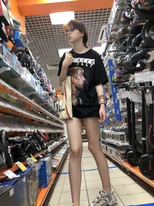 Tall Skinny Girl in Shorts and Sneakers With Long Thin Legs at a Store Creepshots Collection