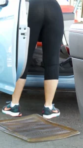 Girl in tight see through leggings with nice ass cleaning her car