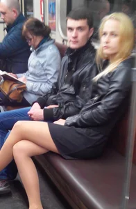 Blonde in a Skirt With Crossed Legs Busted the Photographer in the Subway Train