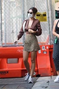 Emily Ratajkowski in mini skirt out for a walk with a friend in New York