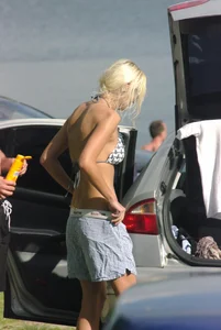 Blonde babe changing into and out of bikini and shows her tits