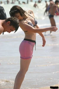 A bunch of sexy beach voyeur babes in bikinis, thongs and topless