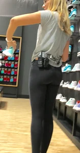 Shoe store employee with a sexy bubble butt in leggings