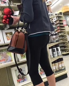 Sexy lady shopping at Walmart in leggings