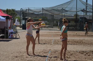 Beach volleyball blonde looking sexy and showing her body off