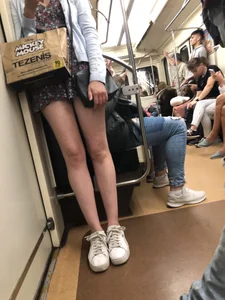 Blonde with Cute Skinny Legs in a Dress Standing in a Subway Train Creepshot