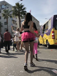 Hot carnival girl in in a top, mini shorts with pink frill and awesome legs in fishnet pantyhose
