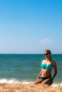 Blonde milf in blue thong bikini