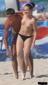 A bunch of sexy beach voyeur babes in bikinis, thongs and topless