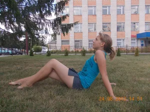Teen JB Sitting on Lawn in a Skirt with Bare Feet