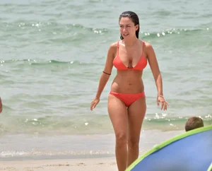 Two sexy ass girls on the beach in bikinis