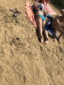 Hot Candid Girls Lying on the Beach in Swimsuits Gallery