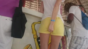 Milf in yellow shorts with vpl and a wedgie