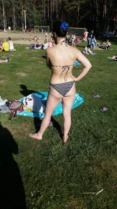 Milf in Swimsuit Standing Shoeless on the Grass Beach Creepshot