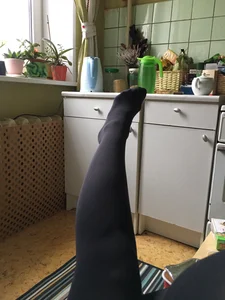 Leg and Foot in Black Pantyhose Kitchen Selfie