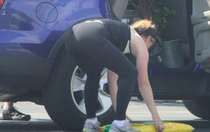 Redhead milf with a nice ass and vtl in leggings while loading her car