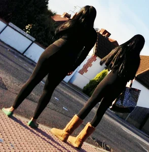 2 sexy black girls in leggings with nice asses