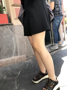 Very nice legs of a candid girl wearing a skirt