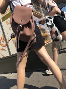 Couple of Skinny Girls in Mini-Skirts And Sneakers Street Photos