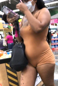 Latina with hard nipples and a big booty in tight spandex shorts outfit