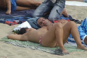 Topless girls on a beach in Barcelona