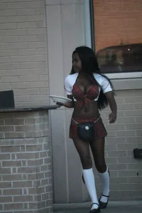 Sexy ebony Tilted Kilt employee in her uniform