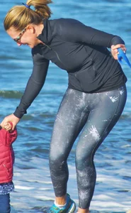 Beach redhead milf in patterened leggings at the beach