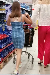 Skinny candid girl in a short dress shopping at the supermarket creepshots