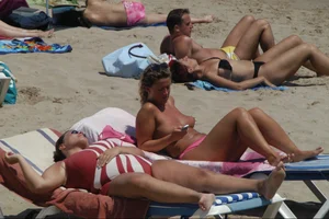 Girls on a nude beach in Sitges, Spain