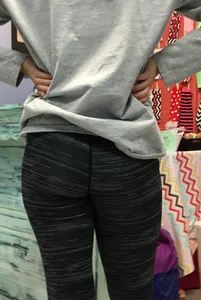 Ass standing around in tight grey patterned leggings