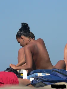 Hot ass topless beach girl with great tits lets her little brother oil up her ass in thong bikini